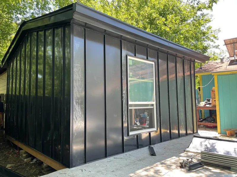 Black standing seam metal wall panels for Roof Inspection in Alvarado